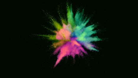 super slow motion of colored powder explosion isolated on dark background.