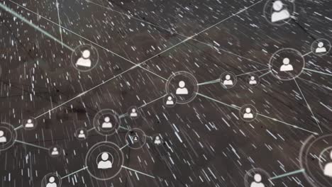 animation of network of connections with people icons over snow falling on grey background