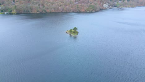 islet amidst ullswater glacial lake in cumbria, england