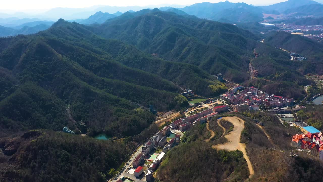 Aerial: abandoned Dragon Park at Mount Jiuhua during the day in Chizhou City, Anhui Province, China, establishing drone shot