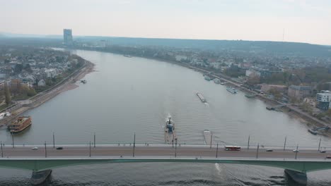 Drone---Aerial-shot-of-the-panorama-of-Bonn-Kennedybücke-Kennedy-bridge-ships-and-the-post-tower-with-the-river-rhine-25p