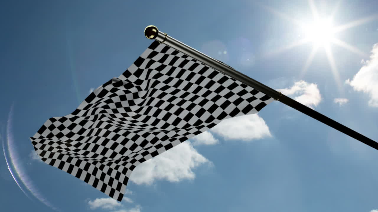Bandeira quadriculada tremulando contra o céu azul