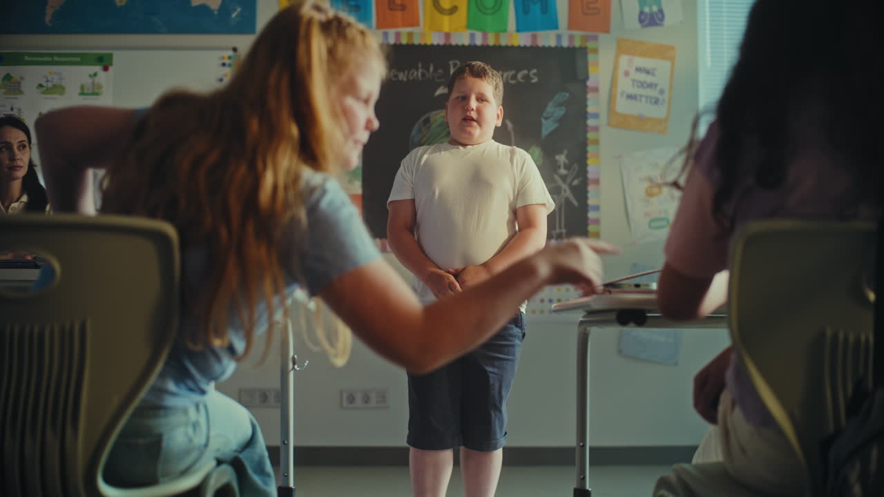 Primary School Boy Showcasing Knowledge Using Digital Screen with Chromakey Mockup