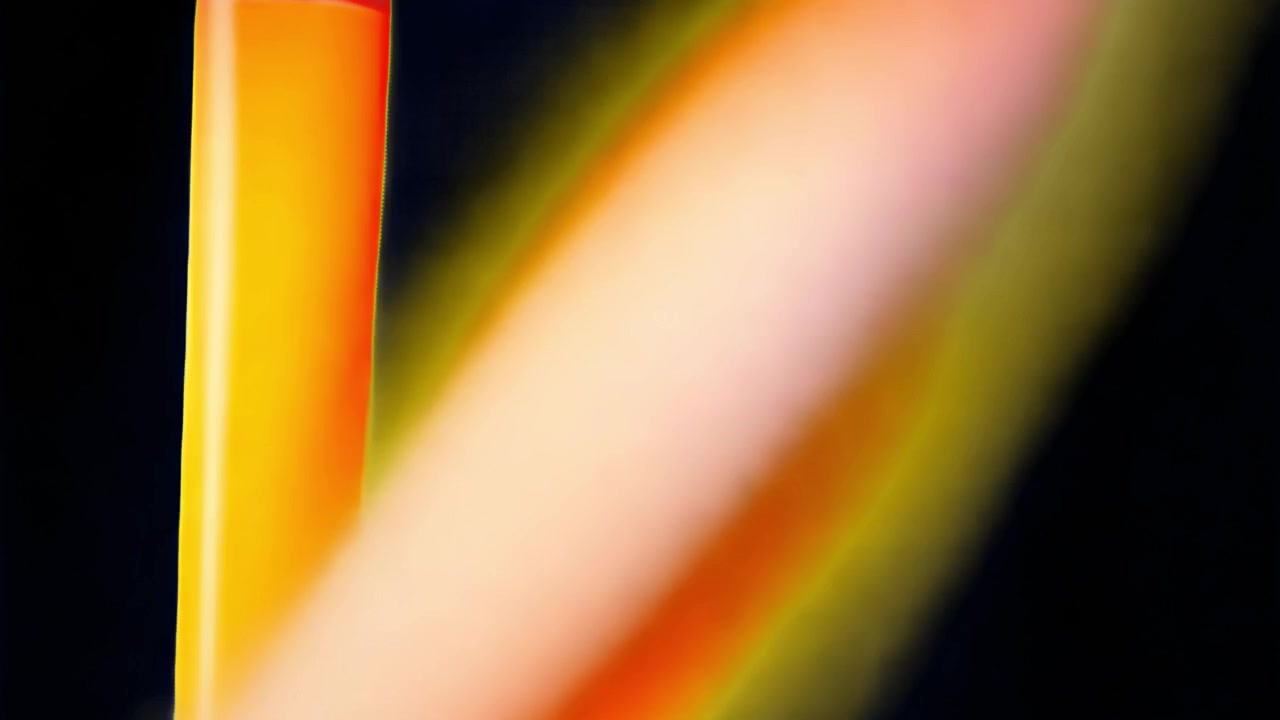 Abstract Motion of Glowing Orange and Yellow Light Streaks