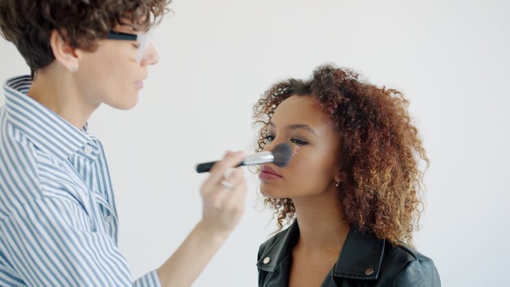 Makeup Artist Applying Makeup to Model