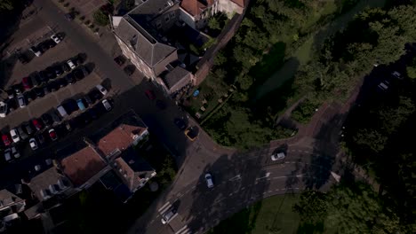 Top-down-time-lapse-of-cars-on-urban-intersection-outside-the-historic-city-wall-of-tower-town