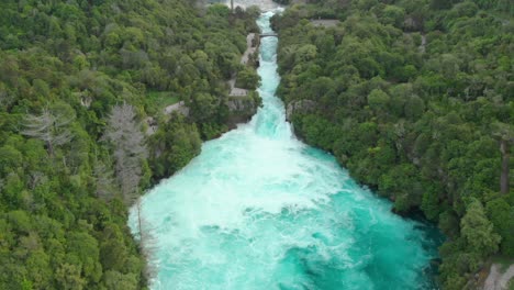 slowmo - aerial drone descending shot of huka falls and raging waikato river near lake taupo, new zealand