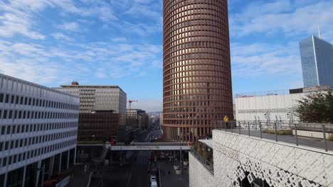 Sky-Towers-and-Modern-Architecture,-Connected-by-Bridge-Tramway-Stations-and-Trade-Malls,-Defining-the-Cityscape-of-Lyon,-France