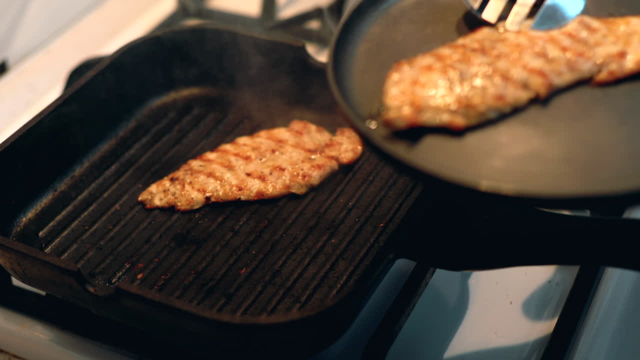 Chicken breast being prepared on a grill pan