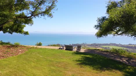 Aerial-Over-Outdoor-Furniture-And-View-Of-Carpinteria-California-And-Establishing-Santa-Barbara-Coastline-Below-2