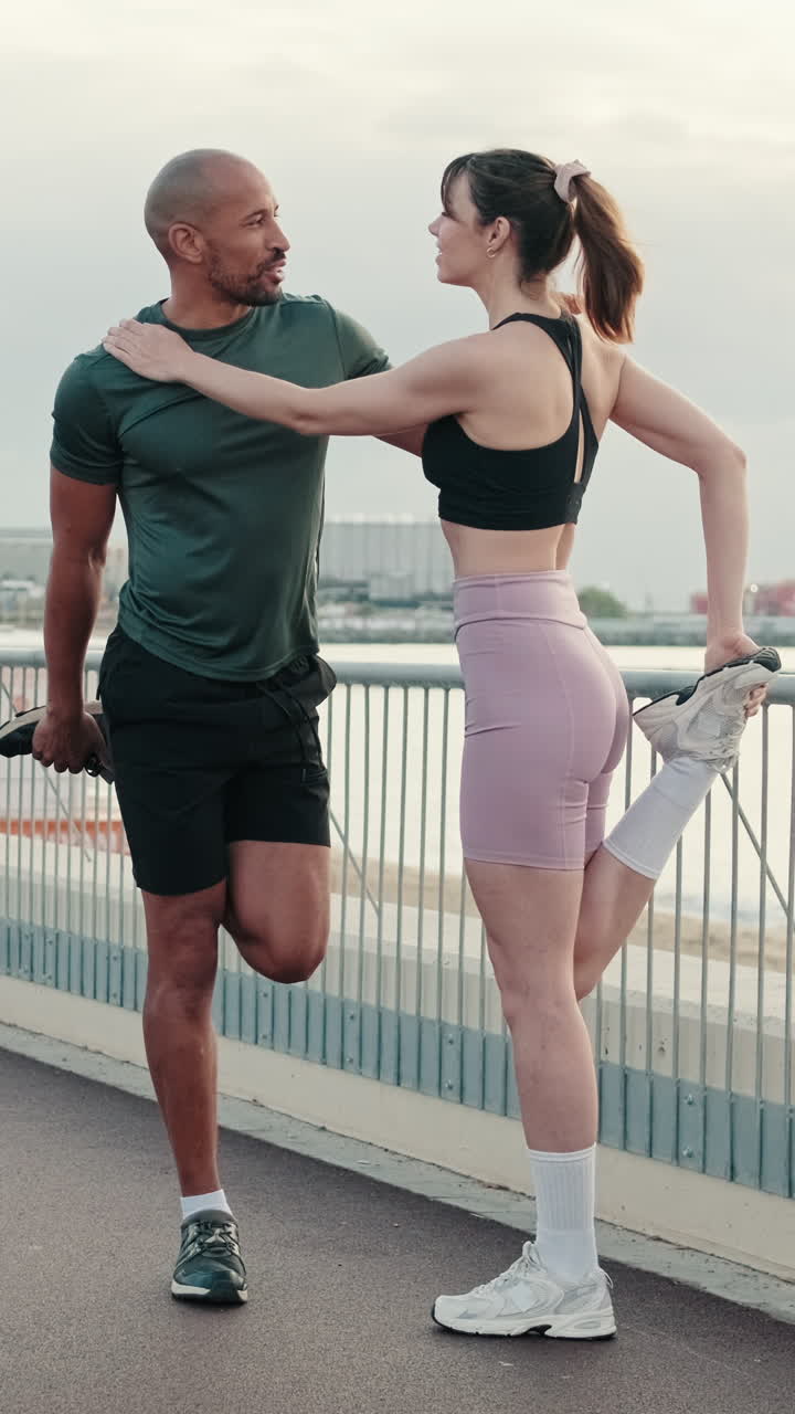 Couple Stretching Together Outdoors