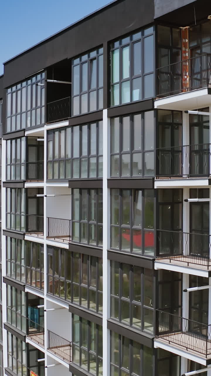 Aerial view of apartment complex. Aerial view of residential complex for young families. Vertical video