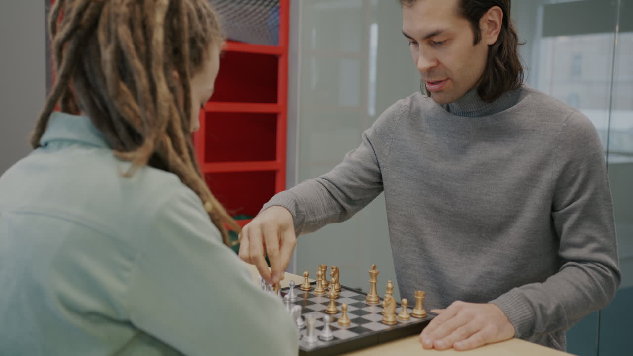 People Playing Chess in an Office