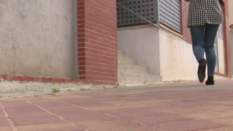 woman walking down steps