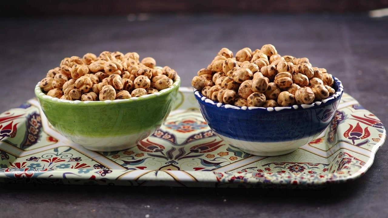 Traditional Roasted Chickpeas in Colorful Bowls on a Decorative Tray