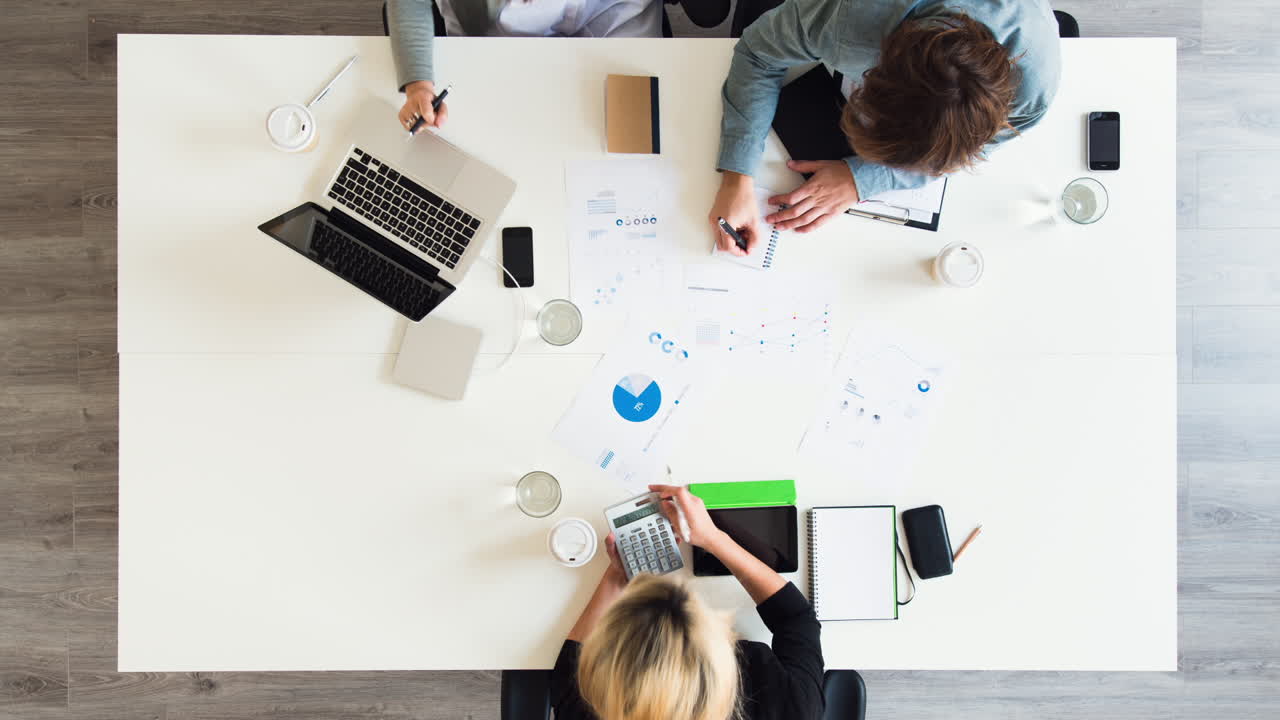 Diverse group of people aerial view timelapse creative business meeting planning thinking ahead startup company