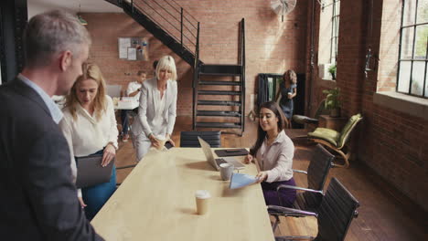 steadicam shot in of diverse business team meeting