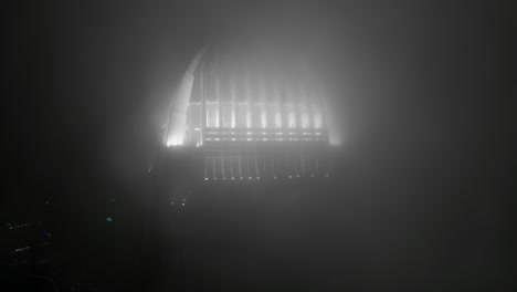 ifc in clouds, fog, at night