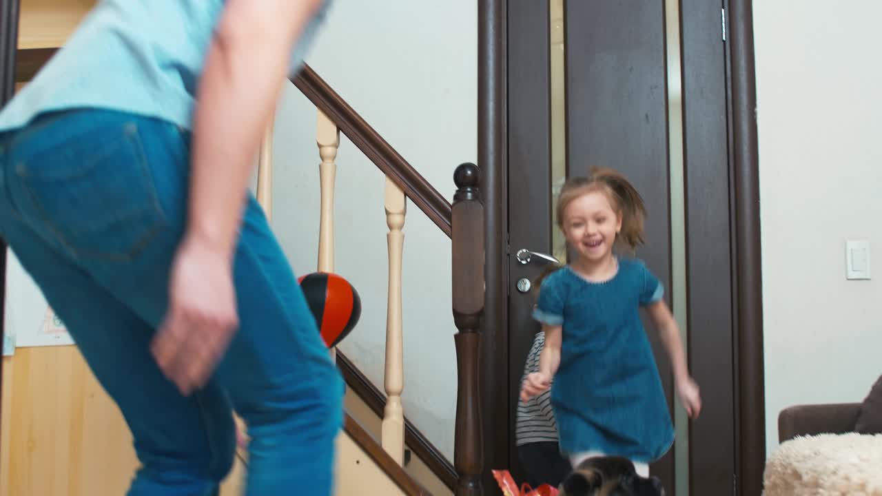 Two kids finding out box with puppy as present