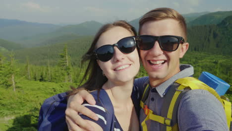 a happy couple of tourists photographed themselves smiling at the camera against the background of a