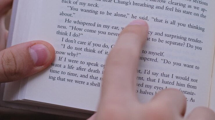 Man disappointed by a slow wi-fi start to read a book. Daily life situations. Brown background. Close up