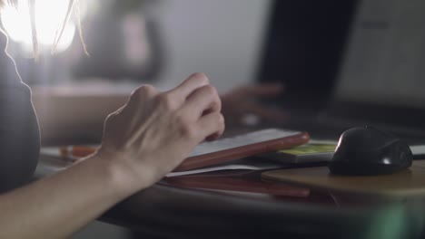 Woman-scrolls-on-her-phone-while-sitting-in