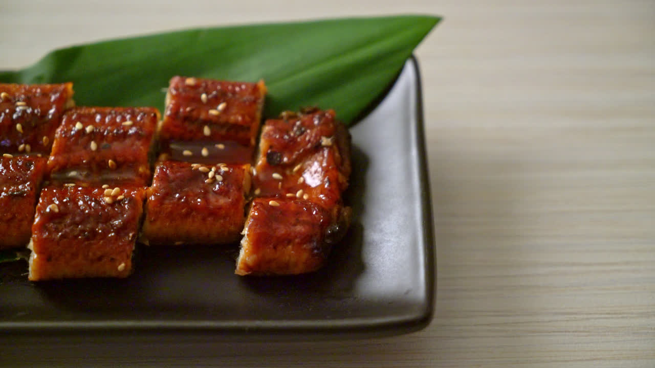 sliced grilled eel or grilled unagi with sauce (Kabayaki) - Japanese food style