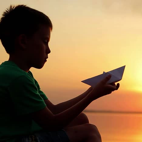 Boy Launching Paper Boat