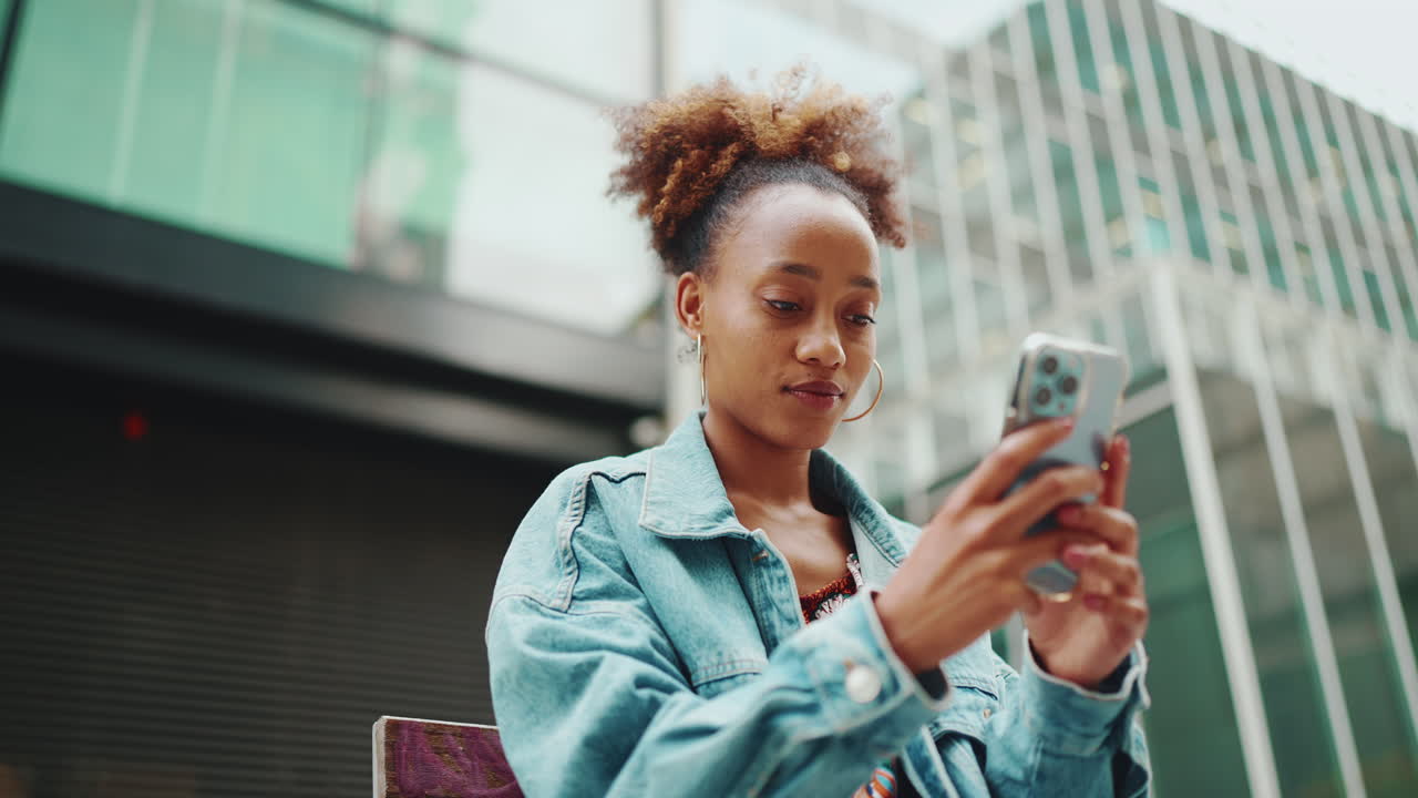 Woman using smartphone in urban setting