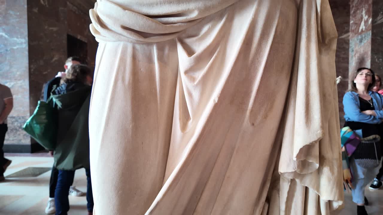 Marble Statue of a Woman in a Museum