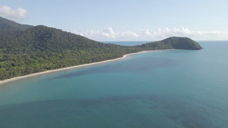 panorama of myall beach and forested headland of cape tribulation in qld, australia