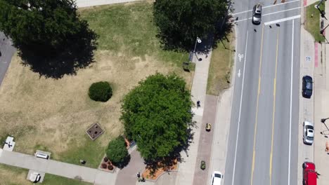 aerial view of urban park and street with traffic