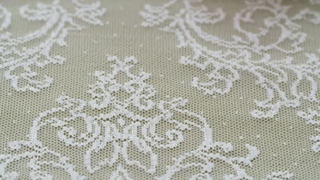 white lace close-up. sewing a wedding dress. light guipure. handmade tailoring, professional clothing concept. abstract background