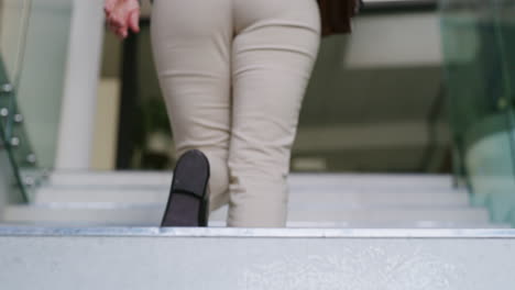 person climbing stairs in business attire