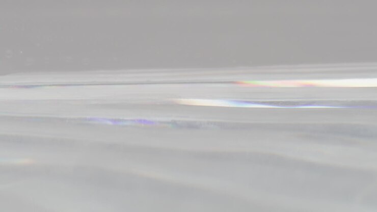 Water in glass tank with reflecting light and movement