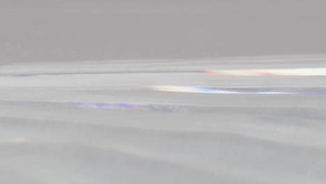 water in glass tank with reflecting light and movement