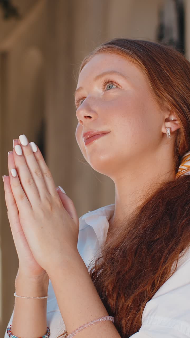 Portrait of teenager girl praying closed eyes to god asking for blessing help forgiveness outdoors