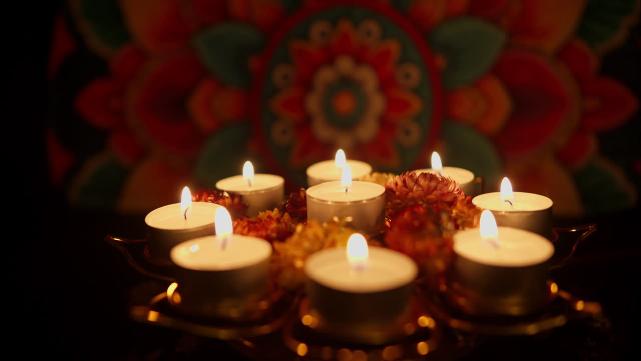Hand Lighting Tea Light Candles on a Decorative Tray