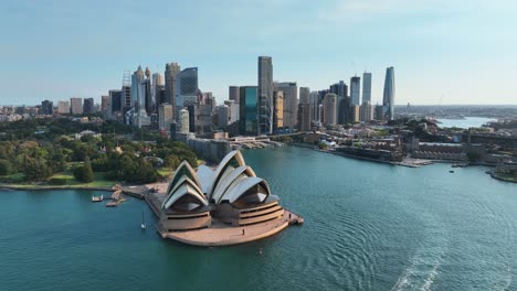 sydney australia flying over bay towards sydney opera house and skyscrapers