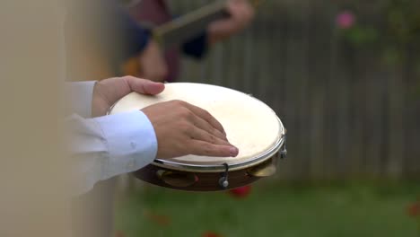 Closeup-of-tambourine-player