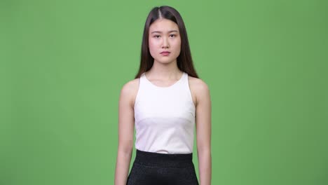 young beautiful asian businesswoman smiling