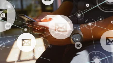 animation of message icons and network of connections over mid section of man using smartphone