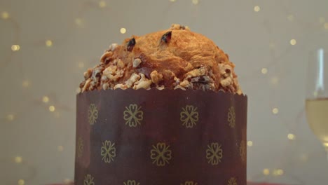 traditional italian panettone and champagne. close-up panning shot