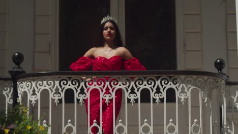 In-the-atmospheric-corridors-of-a-historic-Caribbean-castle,-a-young-lady-in-a-red-gown-captivates-the-imagination