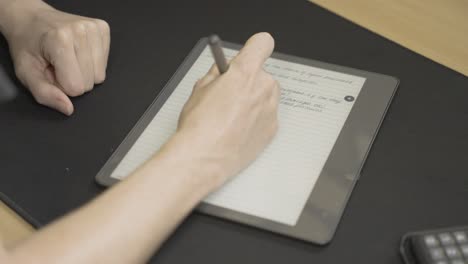 neat cursive note-taking on smart tablet in slow motion