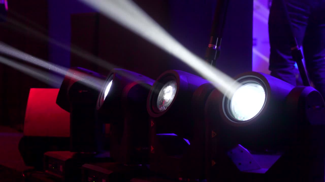 Four black light equipments on the floor of the stage