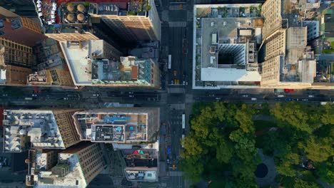 Through-the-streets-of-New-York-City,-people-and-vehicles-travel