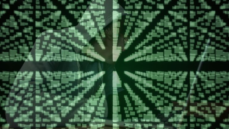 Cyber security data processing against male hacker using laptop