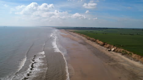 rotating establishing drone shot over fraisthorpe beach uk east coast