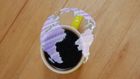 white ceramic coffee cup generating holographic digital globe projection over warm wooden tabletop